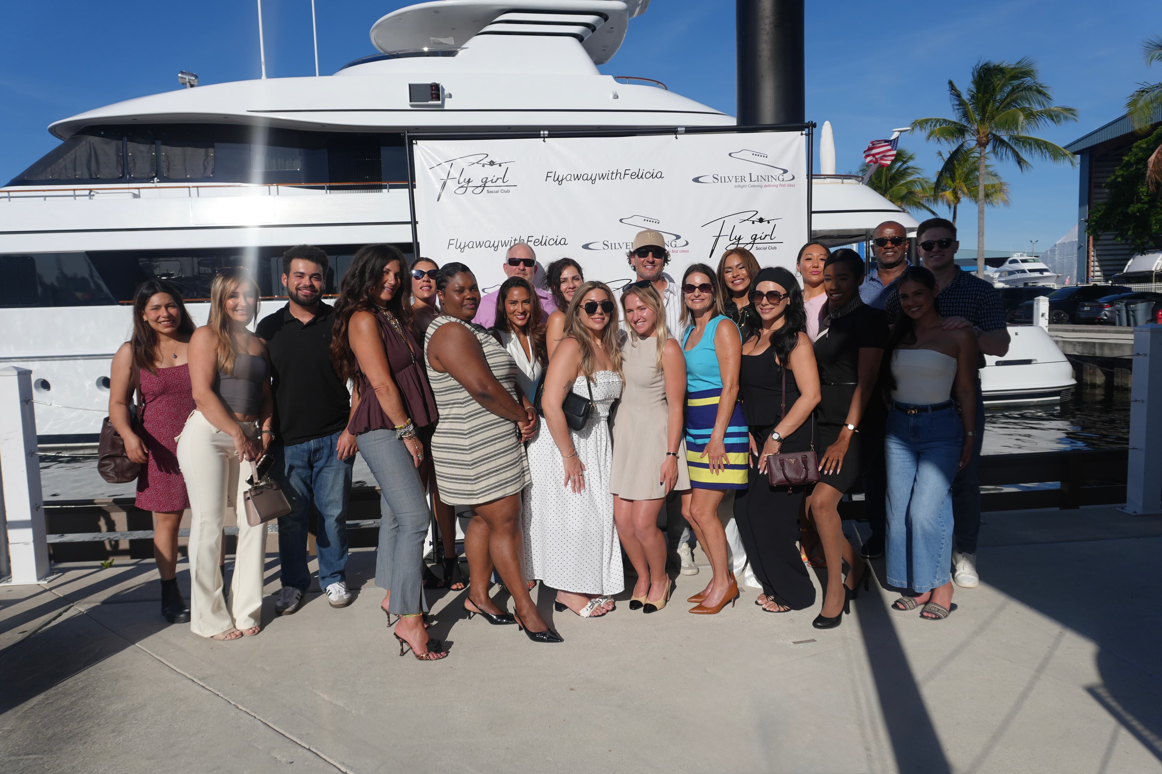 Women in aviation gathered in an elegant private hangar near a private jet